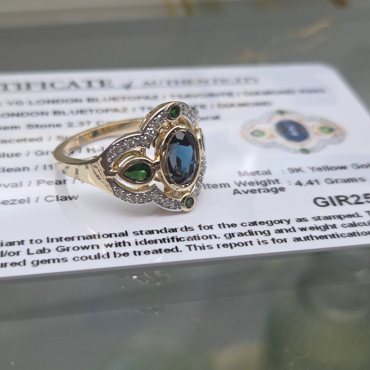 9ct Blue Topaz & Tsavorite Garnet Ring