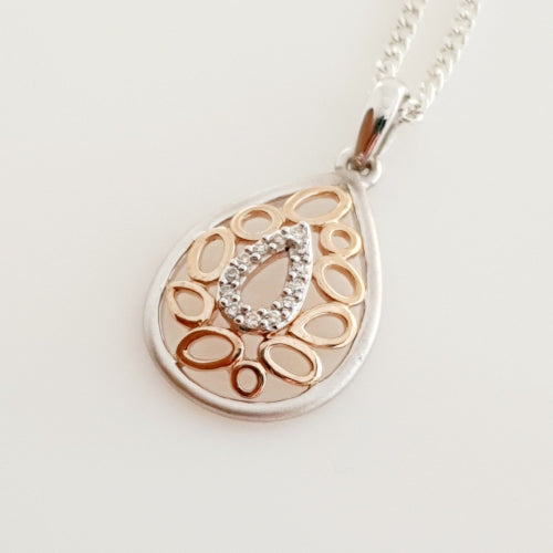 9ct white gold & rose gold Diamond pendant.