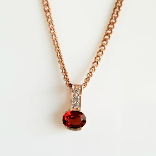 9ct rose gold Garnet and Diamond pendant.