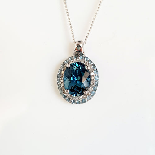 9ct white gold Topaz and Diamond pendant.