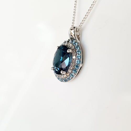 9ct white gold Topaz and Diamond pendant.