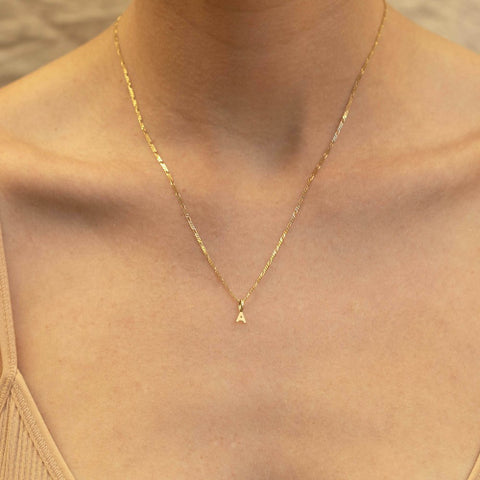 9k Tiny Diamond Charm