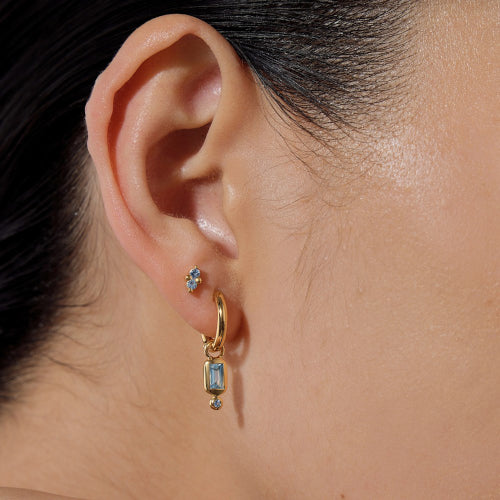 Raya Blue Topaz Huggie