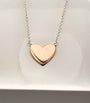 Sterling silver and rose gold plated heart necklace.