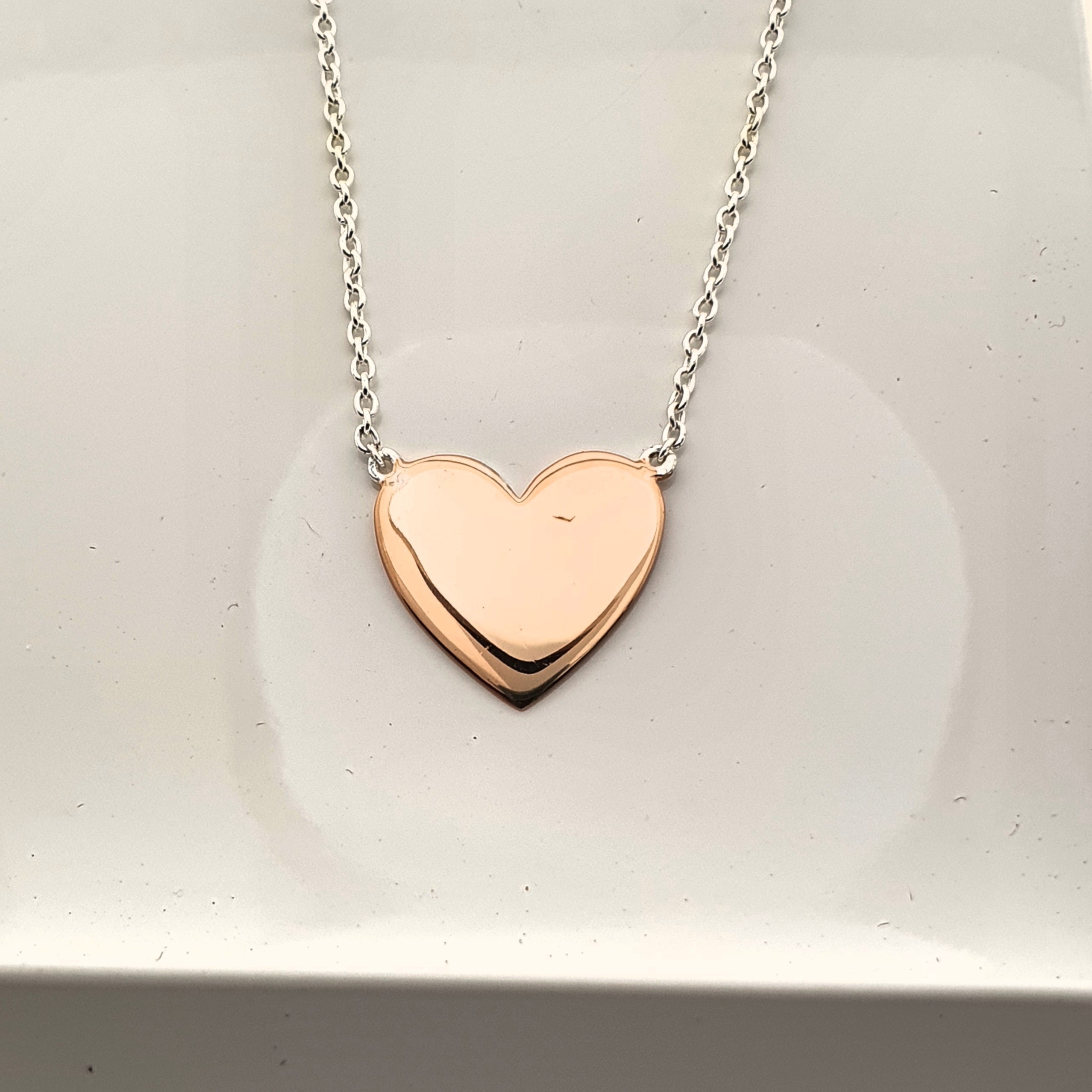 Sterling silver and rose gold plated heart necklace.
