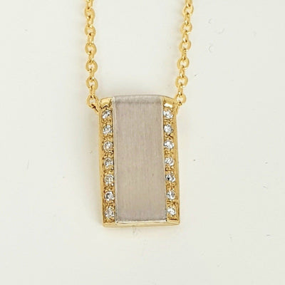 18ct two tone Diamond pendant.