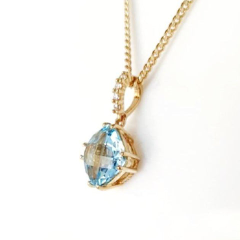 9ct blue topaz and diamond pendant