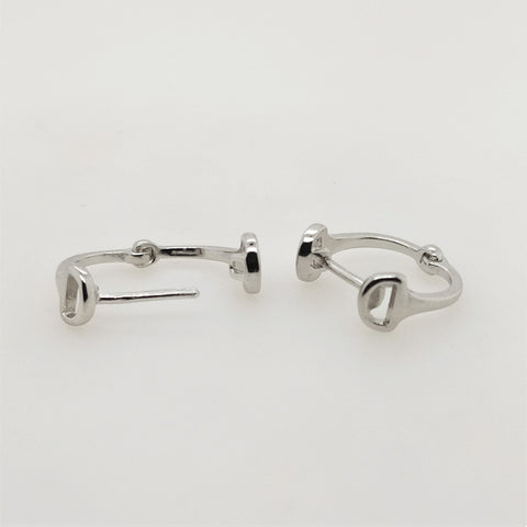 Sterling silver snaffle huggie earrings.